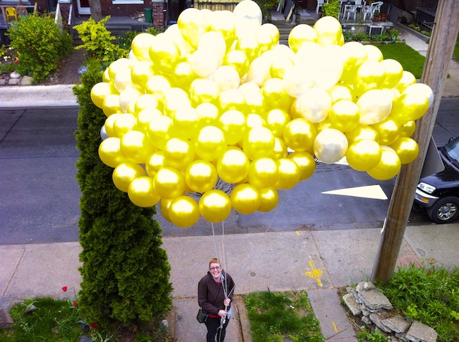 Leahjane Robinson with 300 balloons, used for a protest at Hudbay's shareholder meeting. 