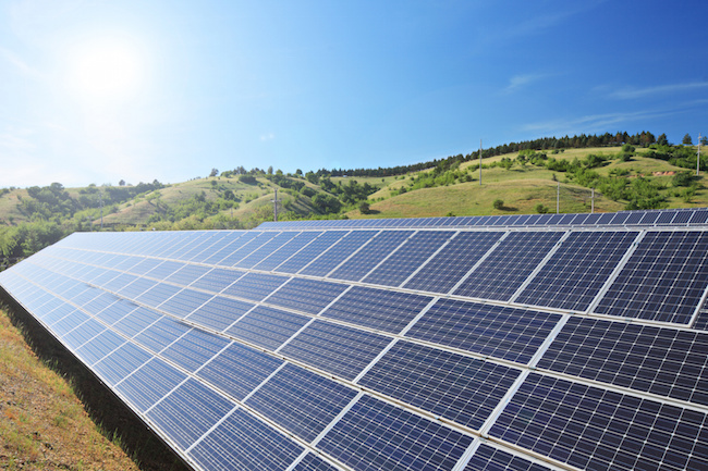 Solar panels on a hill.